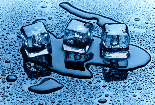 Photo: Ice cubes over dark background Ice cubes over dark background
