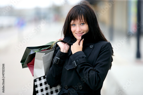 Photo: Woman holding shopping bags Woman holding shopping bags