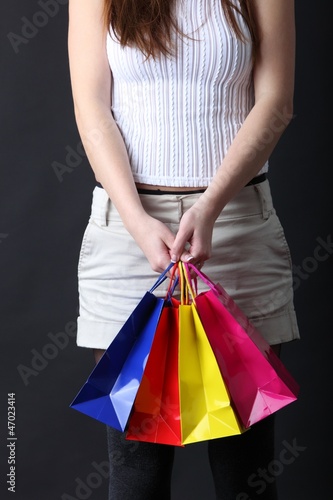 Photo: young woman with shopping bags young woman with shopping bags