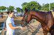 female rider hugging with her horse