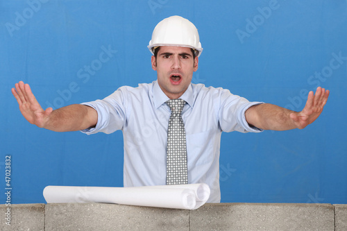 Photo: Architect gesturing stop Architect gesturing stop