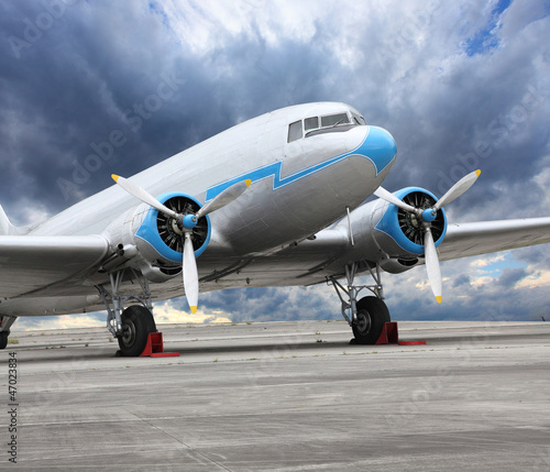 Photo: Retro cargo plane on the runway. Retro cargo plane on the runway.