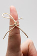 Finger with string to remind you