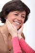 portrait of loving mother and daughter stroking her face
