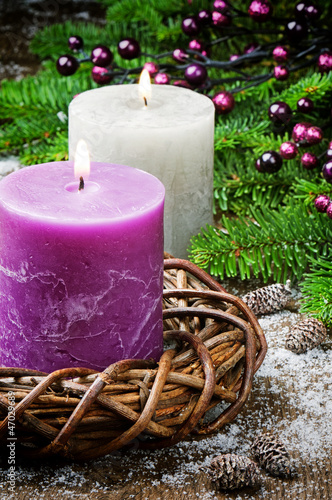 Photo: Burning candles on festive Christmas background Burning candles on festive Christmas background