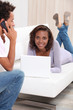 Couple on phone and laptop