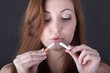 Photo: woman and stop smoking cigarette (focus on cigarette) woman and stop smoking cigarette (focus on cigarette)