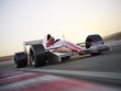 Indy car racer with blurred background