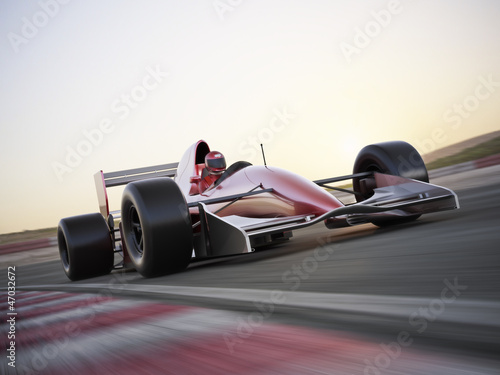 Fototapeta Indy car racer with blurred background