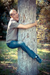 Photo: Funny Man Clinging to a Tree Funny Man Clinging to a Tree