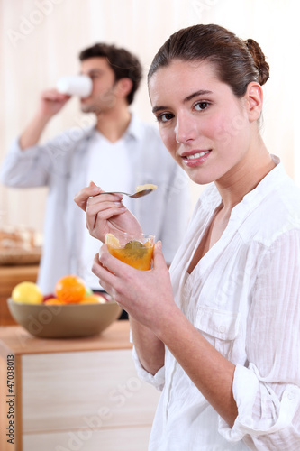 Photo: Man and young woman having breakfast Man and young woman having breakfast