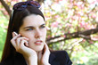 beautiful troubled girl calling phone outdoor