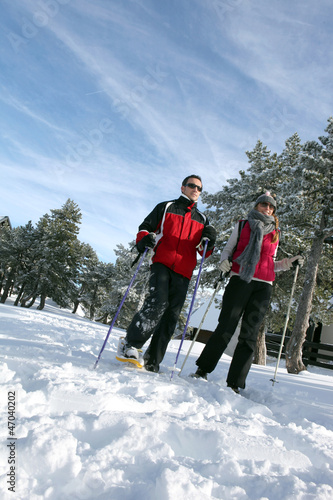 Photo: Couple going skiing Couple going skiing