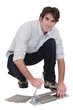Man with a tile cutter