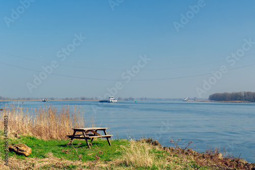Photo: Picnic table near Dutch river Picnic table near Dutch river