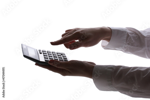 Photo: silhouette of woman's hands with calculator isolated on white . silhouette of woman's hands with calculator isolated on white .