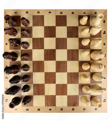 Photo: Chess board with chess pieces isolated on white Chess board with chess pieces isolated on white