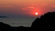 Dramatic sunset over the island and ocean