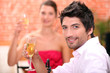 Couple on a date drinking champagne.