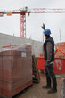 Worker making a sign to another worker