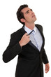 Man loosing tie