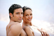 Couple in swimsuit at the oceanside