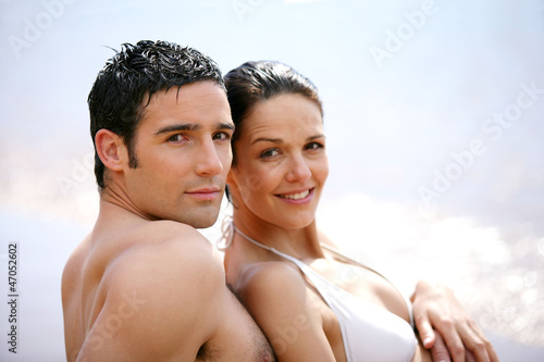 Photo: Couple in swimsuit at the oceanside Couple in swimsuit at the oceanside