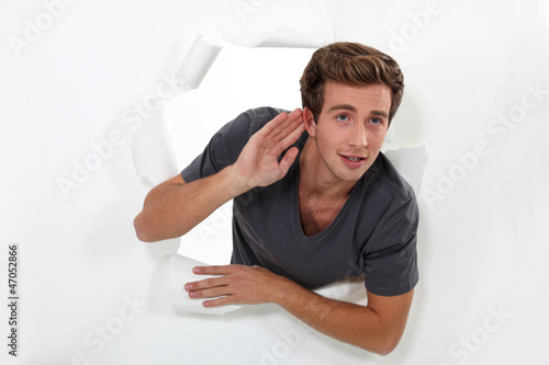 Photo: A young man with hearing problems. A young man with hearing problems.