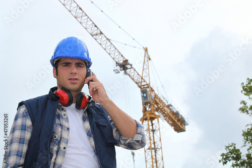 Photo: A foreman on his phone onsite. A foreman on his phone onsite.