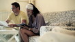 Vídeo: Young couple doing family finances at tablet computer at home Young couple doing family finances at tablet computer at home