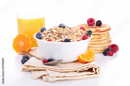 Photo: breakfast with muesli,berries and parncakes breakfast with muesli,berries and parncakes
