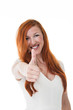 Attractive redhead gives the thumbs up
