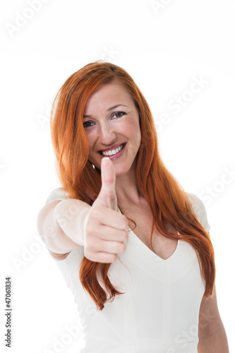 Photo: Attractive redhead gives the thumbs up Attractive redhead gives the thumbs up