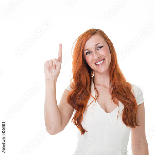 Photo: Beautiful redhead pointing upwards Beautiful redhead pointing upwards