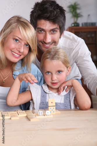 Photo: happy couple and their little girl happy couple and their little girl