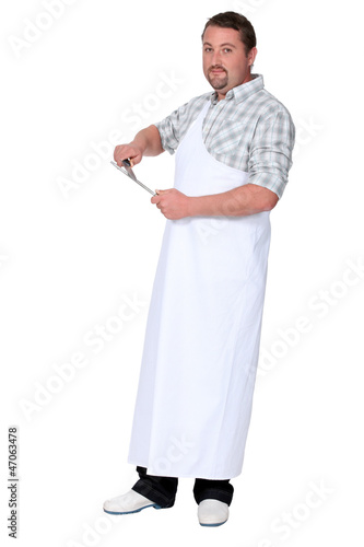Photo: Man sharpening knife Man sharpening knife