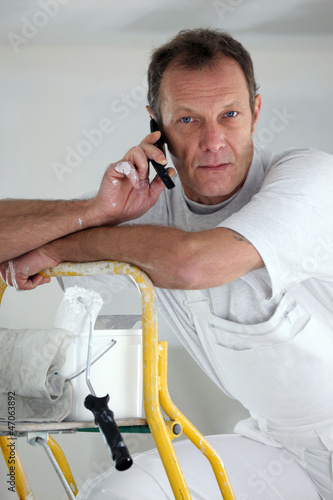 Photo: Portrait of a painter on the phone Portrait of a painter on the phone