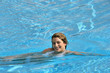 Smiling woman swimming