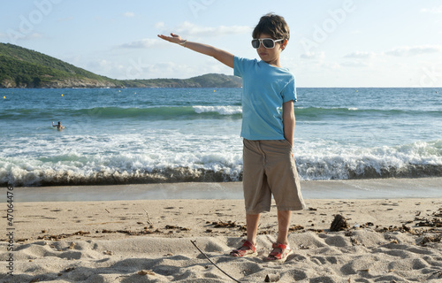 Photo: portrait of little boy on the beach portrait of little boy on the beach