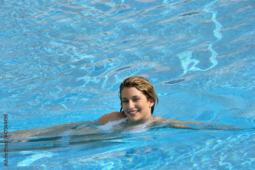 Photo: Smiling woman swimming Smiling woman swimming