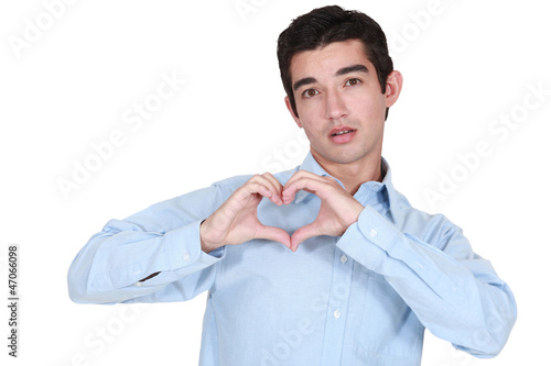 Photo: Man making a heart with his hands Man making a heart with his hands