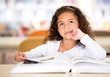 Thoughtful girl reading a book