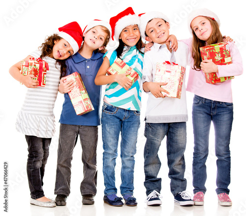 Photo: Happy children with Christmas gifts Happy children with Christmas gifts