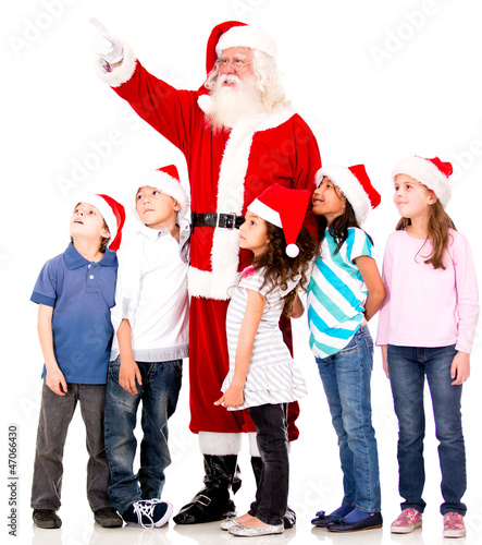 Photo: Santa showing something to kids Santa showing something to kids