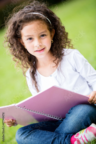 Photo: Cute schoolgirl at the park Cute schoolgirl at the park