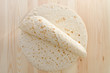 Pita bread on kitchen wooden plank