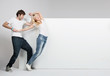 Lovely couple with white board in the background
