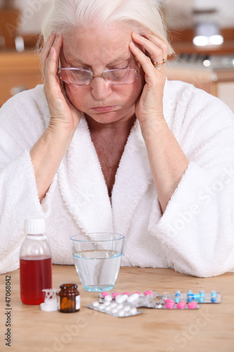 Photo: Old woman with a lot of medicine to take Old woman with a lot of medicine to take