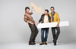 A band of male friends with signs