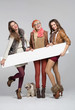 Teenage girls having fun with empty board